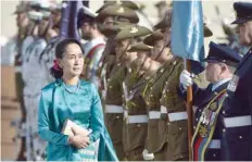  ?? — AFP ?? Aung San Suu Kyi receives an official welcome on the forecourt during her visit to Parliament House in Canberra on Monday.