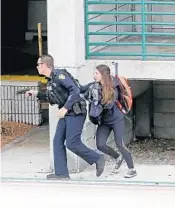  ?? MIKE STOCKER/STAFF PHOTOGRAPH­ER ?? Police respond to shooting.