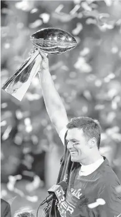  ?? GREGORY BULL/AP ?? Tom Brady celebrates once again with the Vince Lombardi Trophy after leading the Buccaneers to a 31-9 win over the Chiefs in Super Bowl 55 on Feb. 7 in Tampa, Fla. It was Brady’s seventh Super Bowl win, and first with the Bucs.