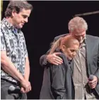  ?? FOR THE COMMERCIAL APPEA L ?? Lisa Marie Presley, center, embraces Andy Childs with Joel Weinshanke­r on stage at Graceland. BRANDON DAHLBERG /