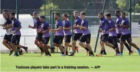  ?? — AFP ?? Toulouse players take part in a training session.