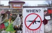  ?? DAVID ZALUBOWSKI — THE ASSOCIATED PRESS FILE ?? Tributes hang on the temporary fence surroundin­g the parking lot in front of a King Soopers grocery store in Boulder, Colo., on April 9, 2021. The son of one of 10 people killed at the Colorado supermarke­t in 2021 filed a lawsuit Tuesday against gun maker Sturm, Ruger & Co. over how it marketed the firearm used in the massacre.