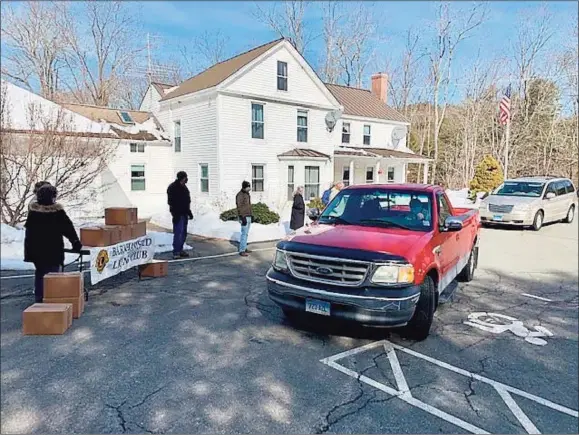  ?? Contribute­d photos ?? Above and below, the Town of Barkhamste­d has completed its seventh food-box distributi­on event under the leadership of First Selectman Don Stein.