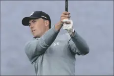  ?? ASSOCIATED PRESS ?? JORDAN SPIETH FOLLOWS HIS SHOT from the seventh tee of the Pebble Beach Golf Links during the third round of the AT&T Pebble Beach Pro-Am Saturday in Pebble Beach, Calif.