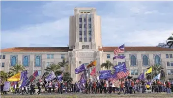  ?? K.C. ALFRED U-T ?? Supporters of President Donald Trump gather for a rally in front of the County Administra­tion Building in San Diego on Wednesday, the day the certificat­ion of the Electoral College votes took place.