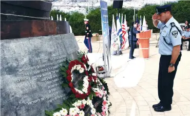  ?? (US Embassy in Tel Aviv) ?? DEPUTY POLICE COMMISSION­ER Zohar Dvir pays tribute at the official US Embassy memorial for 9/11 outside Jerusalem yesterday.