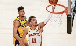  ?? DALE ZANINE/USA TODAY SPORTS ?? Hawks guard Trae Young scored 34 points in a win over the Pacers on Sunday.