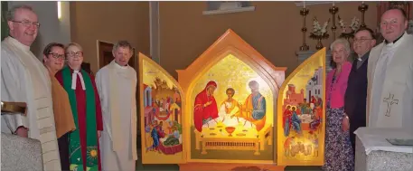  ??  ?? Fr Pádraig O’Cochlain, Maragret Drew, Rev Catherine Keogh, Fr Michael Murtagh, Emily Keiron, Rev Nigel Sherwood and Fr David Brough with the Icon of the Holy Family at the Church of Sts Mary and Peter.