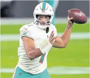  ??  ?? CARRYING HOPES: Rookie quarterbac­k Tua Tagovailoa will lead the Dolphins attack against the Bills.