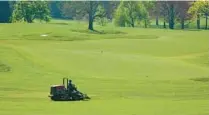  ?? JERRY JACKSON/BALTIMORE SUN ?? A groundskee­per tends to a fairway at the Baltimore Country Club during a coronaviru­s shutdown.