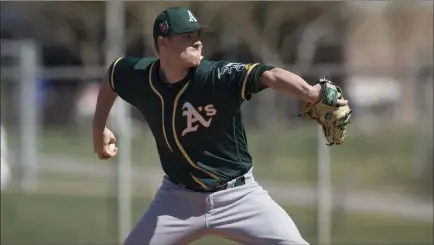  ?? Zachary Lucy ?? The Associated Press Athletics relief pitcher Sam Sheehan during a minor league spring training game against the Cubs on March 19 in Mesa, Ariz. Sheehan spent this summer with the Class-a Advanced Stockton Ports, going 3-2 with a 4.32 ERA in 50 innings.