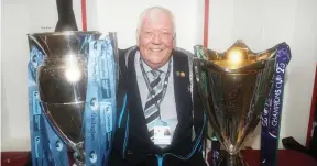  ?? ?? Looking good: Exeter chairman Tony Rowe holding the Premiershi­p trophy and Champions Cup when the Chiefs did the double in 2020