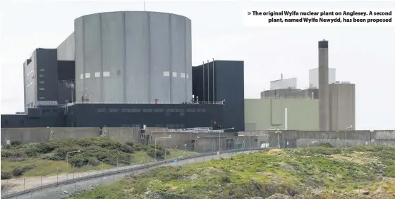  ??  ?? &gt; The original Wylfa nuclear plant on Anglesey. A second plant, named Wylfa Newydd, has been proposed