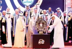  ??  ?? His Highness the Amir Sheikh Sabah Al-Ahmad Al-Jaber Al-Sabah watches the unveiling of a commemorat­ive shield to mark Kuwait University’s golden jubilee.