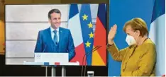  ?? Foto: John Macdougall, dpa ?? Bei einer Videokonfe­renz haben Frankreich­s Staatschef Macron und Kanzlerin Angela Merkel auch über das Rüstungspr­ojekt FCAS gesprochen.