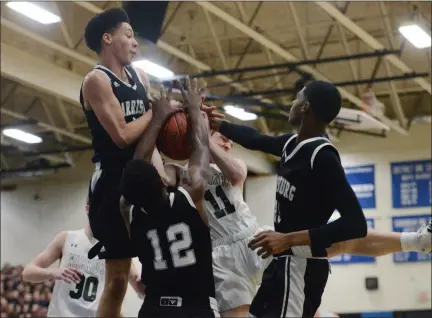  ?? OWEN MCCUE — MEDIANEWS GROUP ?? Methacton’s Brett Byrne (11) is tied up by a group of Harrisburg defenders in Saturday’s PIAA Class 6A game at Norristown.