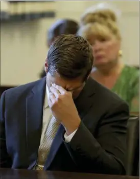  ?? CARA OWSLEY — THE CINCINNATI ENQUIRER VIA AP ?? Former University of Cincinnati police officer Raymond Tensing reacts as Hamilton County Common Pleas Judge Leslie Ghiz declares a mistrial on Friday in Cincinnati. Tensing was charged with murder and voluntary manslaught­er in the shooting of unarmed black motorist Sam DuBose during a 2015 traffic stop.