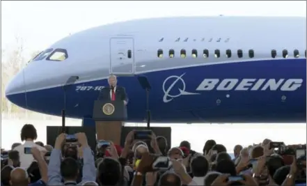  ?? THE ASSOCIATED PRESS ?? President Donald Trump speaks in front of a Boeing 787 Dreamliner on Feb. 17 while visiting the Boeing South Carolina facility in North Charleston, S.C. Trump’s push to get Americans to embrace goods “Made in USA” is harder than it looks. Few products...