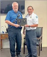  ?? ?? Above: AdventHeal­th Gordon EMS Director Mike Etheridge presents the Leader of the Year Award to Ambulance Shift Captain Mark Bramblett. Left: AdventHeal­th Gordon EMS Director Mike Ethridge presents the Paramedic of the Year Award to Paramedic Thomas “Tad” Helms.