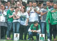  ?? BUDA MENDES/GETTY IMAGES ?? Relatives of the members of Chapecoens­e who died in a plane crash gather for a memorial at the club’s stadium in Chapeco in southern Brazil in December. The disaster claimed the lives of 71 players and staff.
