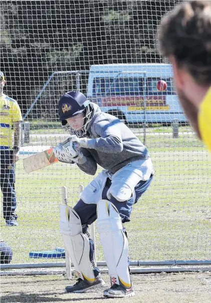  ?? PHOTOS: STEPHEN JAQUIERY ?? Duck and cover . . . There was no hiding in the nets for ODT reporter Sean Nugent when he came up against Otago Volts fast bowler Matt Bacon.