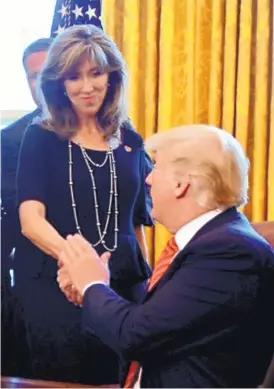 ?? MICHAEL COLEMAN/JOURNAL ?? President Donald Trump greets Southwest Airlines pilot Tammie Jo Shults in the Oval Office on Tuesday. Shults was honored for her emergency landing of a Boeing 737700 in Philadelph­ia after an engine blew apart during a flight from New York to Dallas.