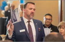  ?? Eddy Martinez/For The Signal ?? Troy Hooper gives a speech at the Poole &amp; Shaffery building during a celebratio­n of the law firm’s service to the community.