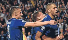  ??  ?? Islam Slimani celebrates his winning goal with team-mates.