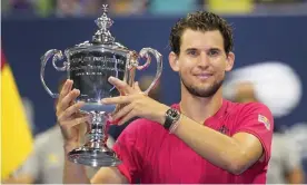  ??  ?? Dominic Thiem holds up the trophy after winning the US Open 2020 final against Alexander Zverev. Photograph: Frank Franklin II/AP