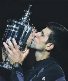  ??  ?? Novak Djokovic celebrates after beating Juan Martin del Potro in straight sets to win the US Open in New York