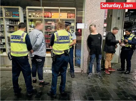  ?? MARK TAYLOR, CHRIS MCKEEN / FAIRFAXNZ ?? Police patrol the alcohol ban areas of Hamilton’s entertainm­ent hub, left, and around Auckland’s Darby St, above.