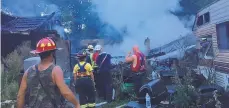  ?? EASTERN BERKS FIRE DEPARTMENT ?? Firefighte­rs from Berks, Lehigh and Montgomery counties respond to a three-alarm house fire in Washington Township, Berks County, on Sunday evening.