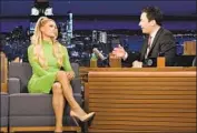  ?? Nathan Congleton NBC ?? JIMMY FALLON, above with Paris Hilton, showed off his nonfungibl­e token Monday during his show.