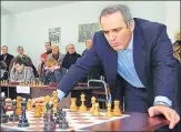  ??  ?? This 2011 file photo shows Garry Kasparov playing simultaneo­us chess games in Tbilisi, during his visit to Georgia.