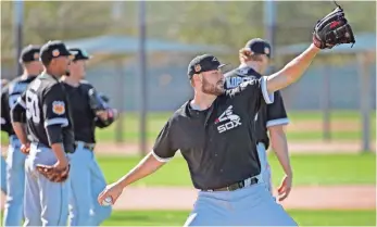  ?? ROSS D. FRANKLIN, AP ?? Lucas Giolito, acquired from the Nationals, warms up at White Sox camp in Glendale, Ariz.