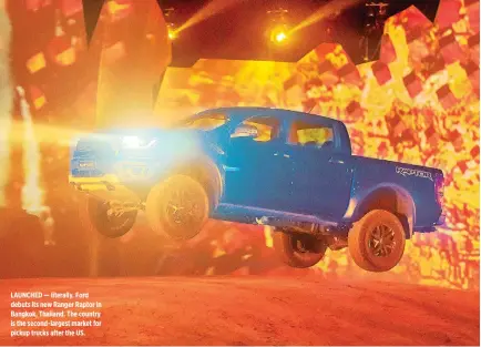  ??  ?? LAUNCHED — literally. Ford debuts its new Ranger Raptor in Bangkok, Thailand. The country is the second-largest market for pickup trucks after the US.