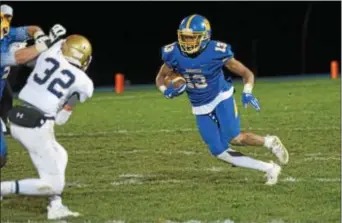  ?? MICHAEL REEVES — FOR DIGITAL FIRST MEDIA ?? Springfiel­d’s Ja’den McKenzie carries the ball Friday against West Chester Rustin. The Cougars piled up a 28-7 victory.