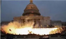  ?? Photograph: Leah Millis/Reuters ?? A police flash-bang grenade is detonated during the attack on the US Capitol on 6 January 2021.