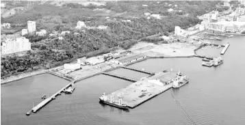  ??  ?? Photo shows an aerial view of Sabah Ports’ Kota Kinabalu Port.The cancellati­on of MMC’s proposed acquisitio­n of a stake in Sabah Ports will allow the group to instead focus on increasing competitiv­eness of MMC’s existing ports, analysts opine.