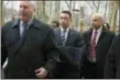  ?? JOHN MINCHILLO — THE ASSOCIATED PRESS FILE ?? Then-Rep. Michael Grimm, center, enters Brooklyn federal court before pleading guilty to a federal tax evasion charge in New York.