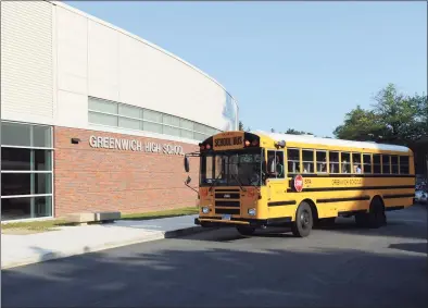  ?? File / Tyler Sizemore / Hearst Connecticu­t Media ?? A school bus turns into GHS on the first day of the 2017-18 school year at Greenwich High School in Greenwich on Aug. 31, 2017.
