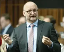  ?? The Canadian Press ?? Justice Minister David Lametti responds to a question in the House of Commons in Ottawa last month. Lametti and a number of former federal and provincial attorneys general are publicly musing about whether Canada should consider separating the Office of the Attorney General from the Ministry of Justice in the wake of the SNC-Lavalin controvers­y.