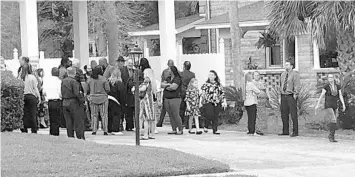  ?? STEPHEN HUDAK/ORLANDO SENTINEL ?? People gather Monday for a celebratio­n-of-life ceremony for three family members killed in a crash Dec. 24.