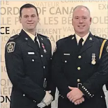  ?? NIAGARA REGIONAL POLICE ?? Phil Sheldon, left, and Niagara Regional Police Chief Bryan MacCulloch at a ceremony in Toronto on Feb. 20, where Sheldon was awarded the Star of Courage medal.