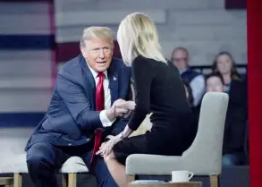  ?? Photos — AFP ?? Trump shakes hands with host Laura Ingraham during a Fox News Town Hall at the Greenville Convention Center in Greenville, South Carolina.