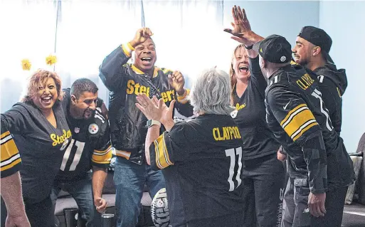  ?? MARK YUEN TORONTO STAR ?? Back from left: Chel and Khul Sanghera, John Mensah and Jasmine Claypool celebrate a Steelers touchdown at a watch party in Abbotsford, B.C., last weekend.