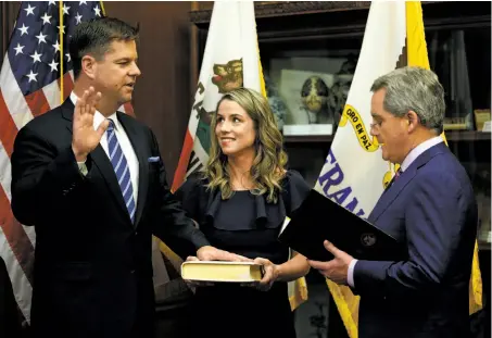  ?? Santiago Mejia / The Chronicle ?? Mark Farrell is sworn in as mayor by City Attorney Dennis Herrera in January. Farrell says he’ll never run for office again.