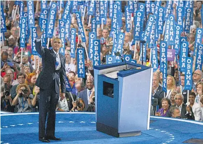  ?? Picture / AP ?? Barack Obama urged the crowd to carry Hillary Clinton ‘the same way you carried me’.