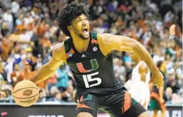  ?? JEFF ROBERSON AP ?? Miami forward Norchad Omier celebrates after win against Texas in Elite 8.
