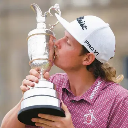  ?? PETER MORRISON/AP ?? Cameron Smith kisses the claret jug after his British Open victory Sunday. Smith shot a final-round 8-under 64 at St. Andrews.